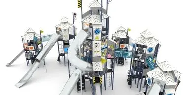 A metal playground structure featuring several towers and slides.