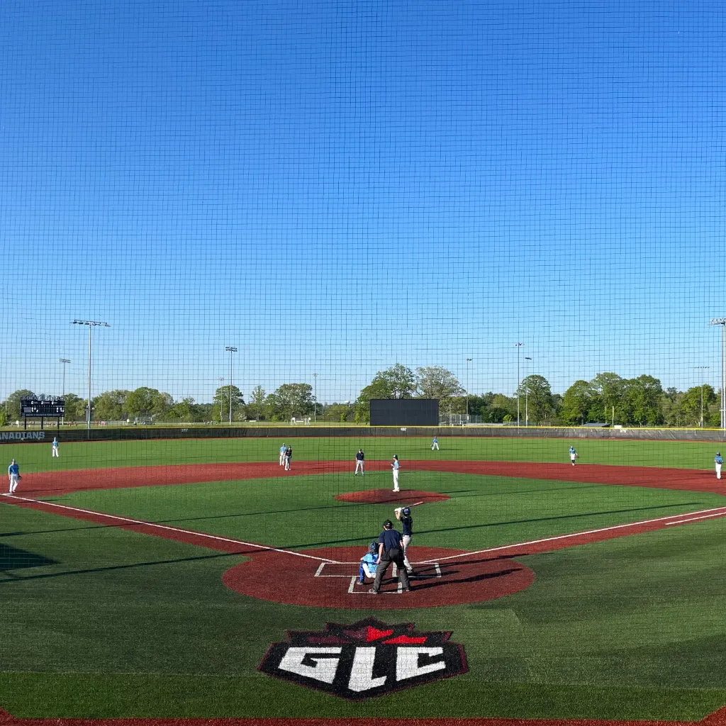 Two local baseball teams play on a field with turf by 39 Seven.