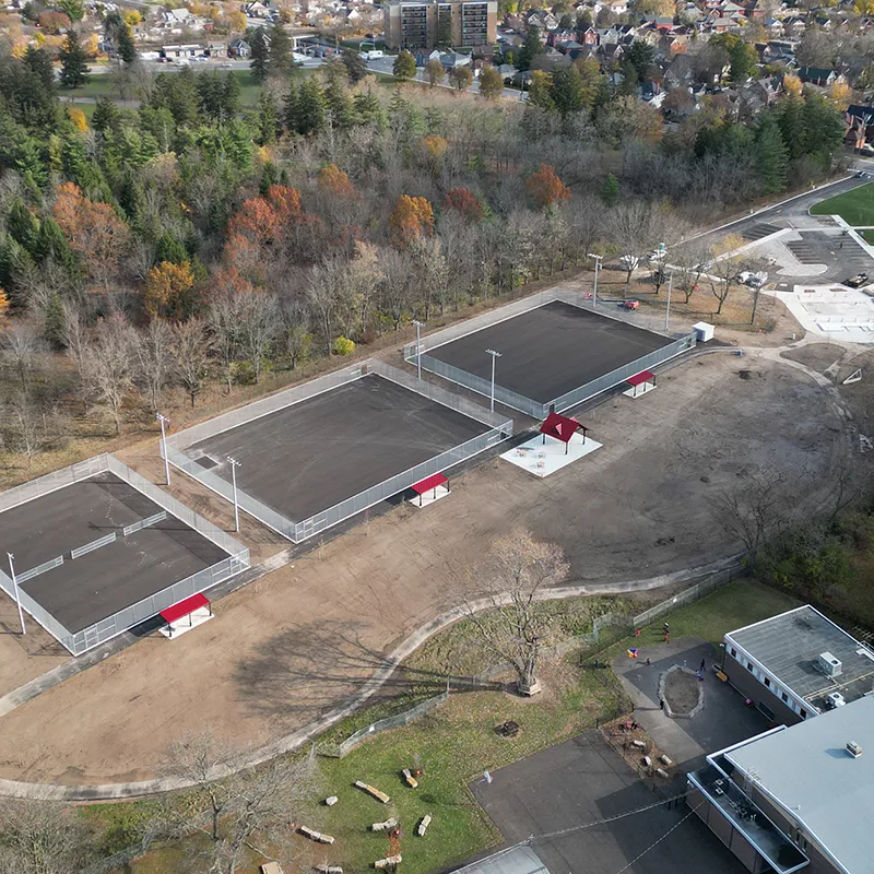 A 39 Seven construction site featuring three court surfaces.